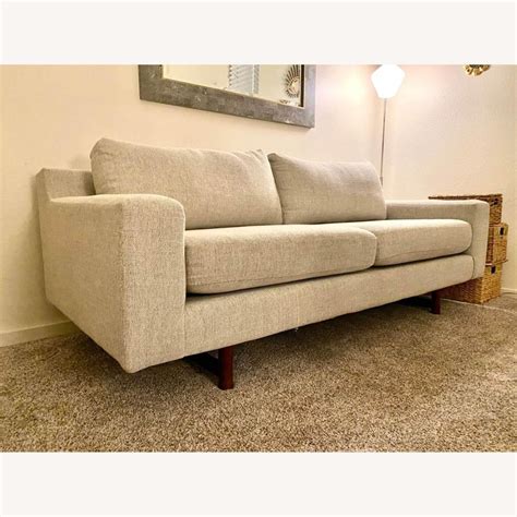 Relax into the wide back cushions and low arms. . West elm eddy sofa
